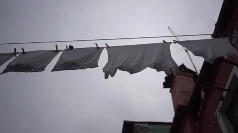 Clothes on clothesline outside. laundry drying outdoor at old italian street Stock Footage 196091039