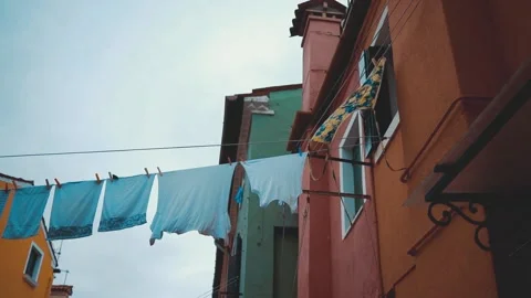 Clothes on clothesline outside. laundry drying outdoor at old italian street Stock Footage 196091066