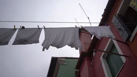 Clothes on clothesline outside. laundry drying outdoor at old italian street Stock Footage 196091095