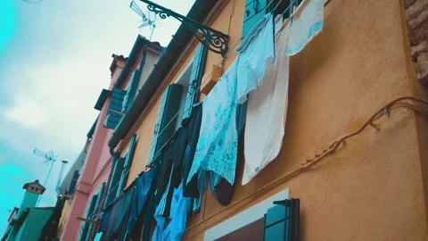 Clothes on clothesline outside. laundry drying outdoor at old italian street Stock Footage 196091128
