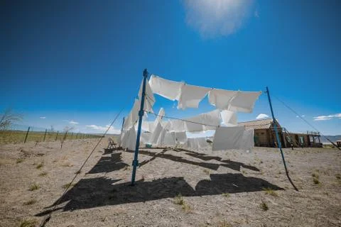Clothes on clotheslines in field Stock Photos