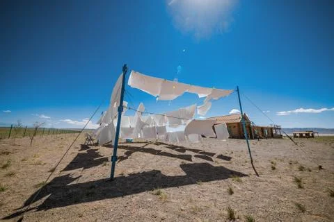 Clothes on clotheslines in field Stock Photos