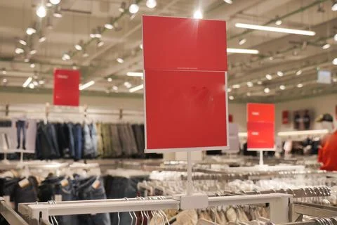Clothes on display with empty signs in a store Foto stock