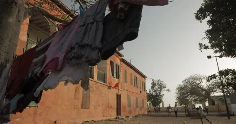 Clothes dried on a line in Goree, Senegal (4K) Stock Footage 47947025