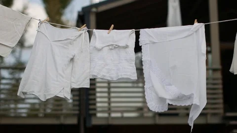 Clothes dries on the background of the house Stock Footage 94560677