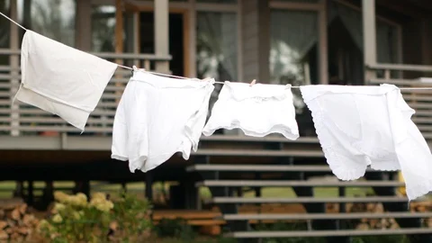 Clothes dries on the background of the house Stock Footage 94560711