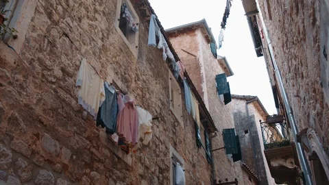 Clothes dry after laundry in old town Video stock 114973281