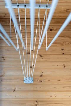 Clothes dryer attached to the ceiling with clothes hanging Stock Photos