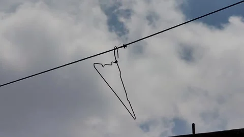 A clothes dryer hanging on a rope Stock Footage 287704223