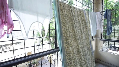 Clothes drying in apartment balcony India Stock Footage 73348542