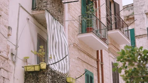 Clothes drying on balconies along the streets of Italy Stock Footage 277360455
