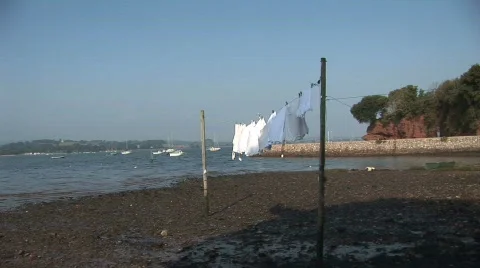 Clothes drying on the beach Stock Footage 524991