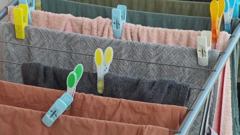 Clothes drying on a foldable clothes horse Stockbeeldmateriaal 315360773