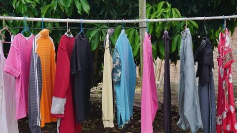 Clothes Drying on a Laundry Line in a Backyard Stock Photos