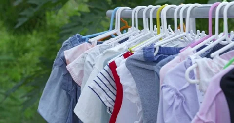 Clothes drying a line outdoor garden natural light domestic life Stock Footage 337785063