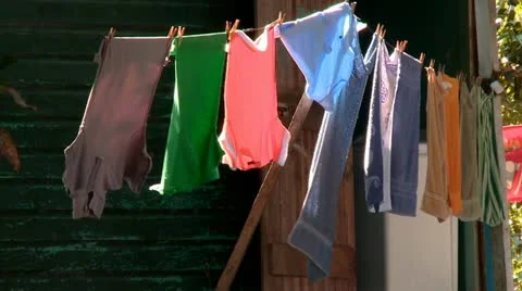 Clothes drying on line in a village Stock Footage 10817063