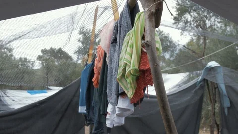 Clothes Drying on a Make Shift Clothes Line at a Refugee Camp in Moria Stock Footage 104821193