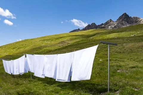 Clothes drying in a prairie of the alps Stock Photos