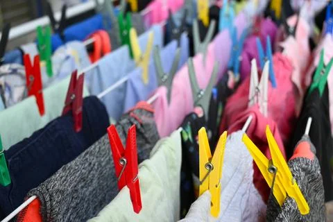 Clothes drying on a rack with clothespins Stockfoto's