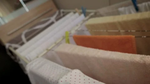 Clothes on drying rack stand Stock Footage 99111740