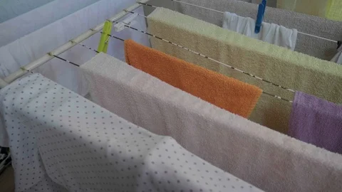Clothes on drying rack stand Stock Footage 99111977