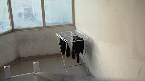 Clothes Drying Rack In Sunlit Urban Stairwell Stock Footage 337441007