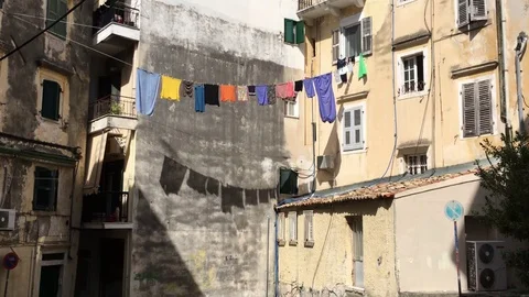 Clothes Drying on The Ropes With Their Shadows Stock Footage 70653545