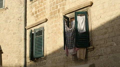 Clothes drying on the window Stock Footage 104978327