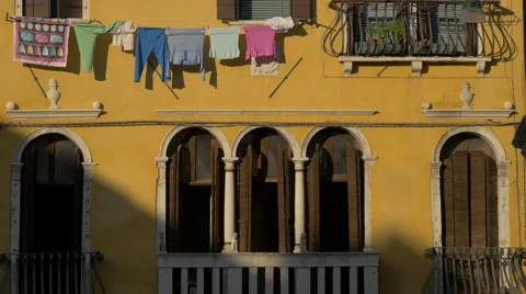 Clothes drying on a yellow building in Venice Video stock 57377747