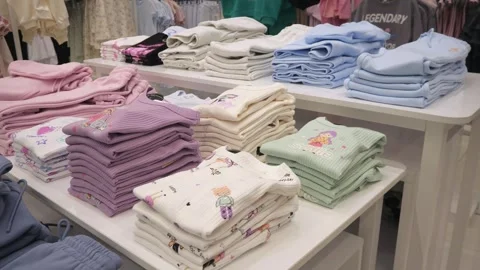 Clothes folded in piles in a store. Stock Footage 266863041