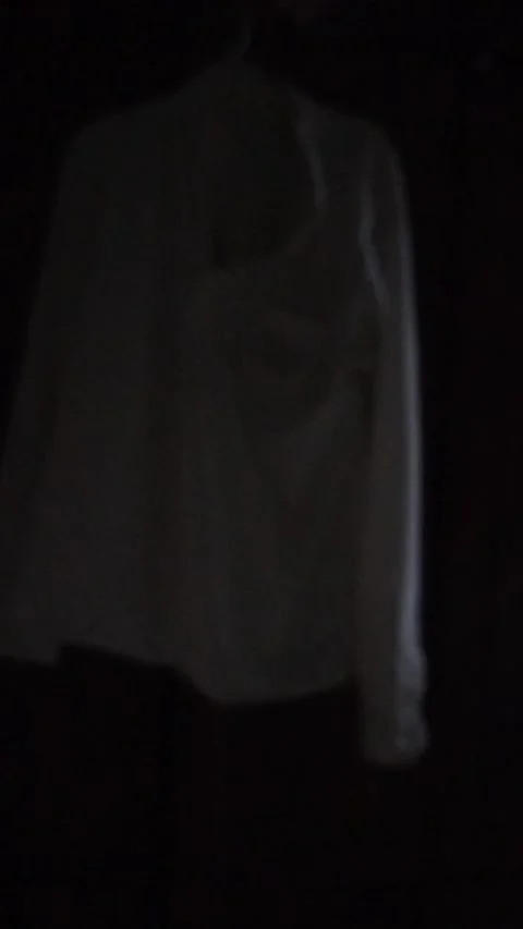 Clothes Gently Swaying in Dark Wardrobe at Night Stock Footage 324509869