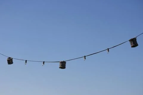Clothes hang on a rooftop line in a calm morning breeze 스톡 사진