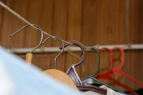 Clothes hang in wardrobe Foto stock