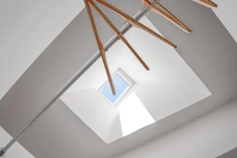 Clothes hanger under skylight Stock Photos