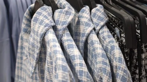 Clothes hanger with a variety of things slow motion, soft selective focus, store Stock Footage 192835564