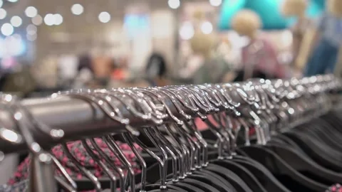 Clothes hanger with a variety of things slow motion, soft selective focus, store Video stock 194562848