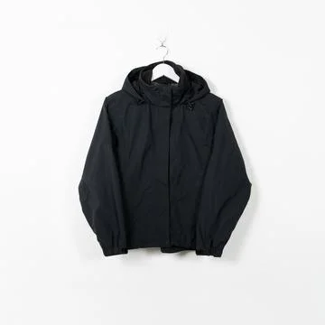 Clothes on a hanger. White wall background. Stockfoto's