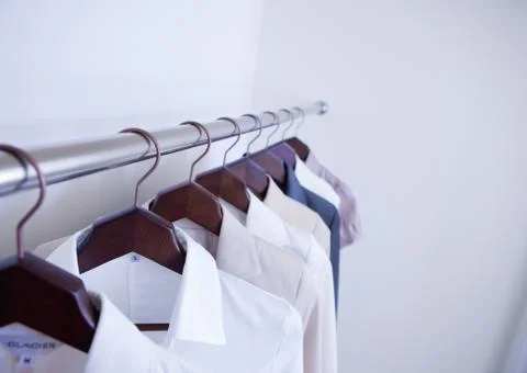 Clothes on hangers Stock Photos