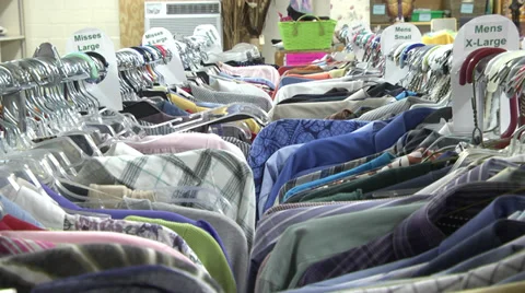 Clothes on hangers in racks Stock Footage 34525677
