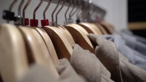 Clothes on hangers in store, close up of textile. Stock Footage 335450878