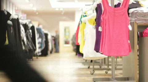 Clothes on hangers in a store Stock-Footage 873709
