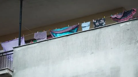 Clothes hanging on the balcony Stock Photos