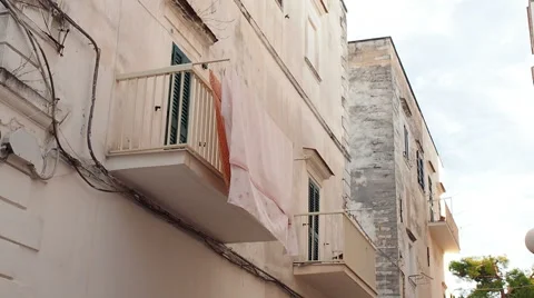 Clothes hanging to dry on balcony Stock Footage 66339718