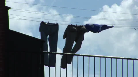 Clothes hanging to dry on the line Stock Footage 25134294