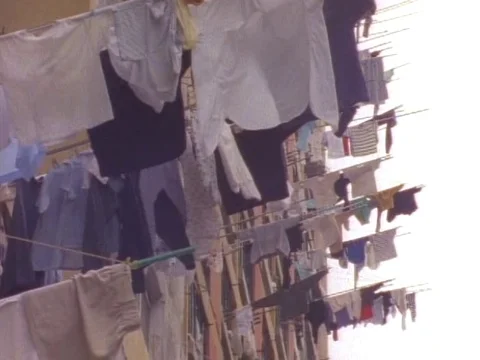 Clothes hanging for drying outside the Hong Kong apartments Stock Footage 79878572