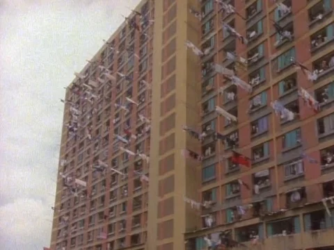 Clothes hanging for drying outside the Hong Kong apartments Stock Footage 79878744
