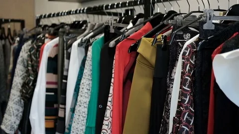 The clothes hanging on the hanger are different in style and texture. Stock Footage 75441939