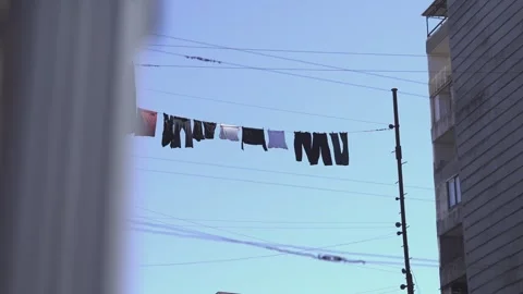 Clothes hanging on a line drying in the wind in batumi Stock Footage 336000760