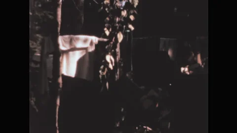 Clothes hanging out to dry in the forest. Amateur video from the 50s Stock Footage 197058983
