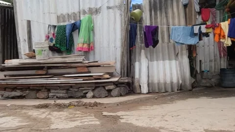 Clothes hanging outside the house on wire in slum area Stock Footage 213205802